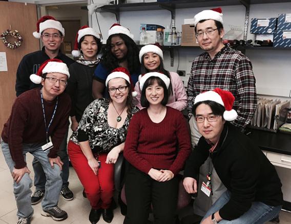 Lab team at Christmas, 2014, wearing Santa hats