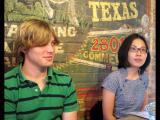 Lab members at restaurant leaning against wall