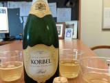 Champaign bottle, cork and 3 three filled glassed on table, celebrating Sean's paper