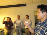 Raghu Chivukula Thesis Defense - attendees raising their glasses