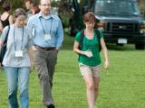 Three team members walking outdoors at CSHL