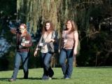 Three women walking outdoors at CSHL