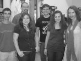 Five team members (in black and white)