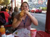 Woman eating sandwich