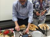 Ryan Golden Thesis Defense - cutting cake