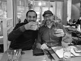 Nick talking science with Dr. Auinash Kalsotra and raising their glasses in a cheer