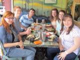Lab team sits at table having a vegetarian lunch