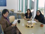 Lab team celebrating Helen's birthday with cake and card