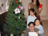 Family and Christmas tree
