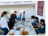 people participating in a potluck luncheon