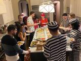 Halloween Event with the Parikh Lab members in costumes around a buffet table.