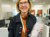 woman holding team mug