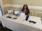 woman at a conference booth