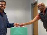 Pravat receives a gift from Dr. Malladi